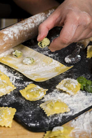 working hard in the kitchen for the family.の写真素材