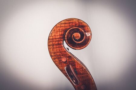 Contemporary antiquated violin  on greyの写真素材