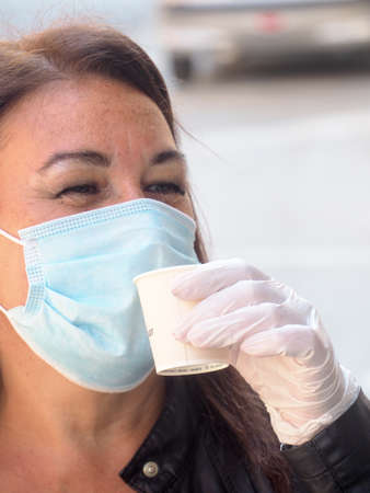 Cremona, Lombardy Italy,  may 2020 -  Bartender at cafe bar slowly open and make drinks only to go - new stage of coronavirus outbreakのeditorial素材