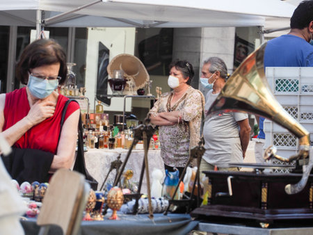 Cremona, Lombardy, Italy - 21st june 2020 - The First Sunday  flea antiques and Vanitas market opened this weekend and attracted customers even though the governor and state health officer concerns people from public gatherings  over coronavirus.のeditorial素材