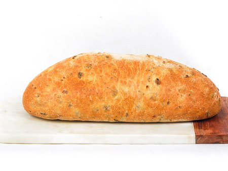 Olive loaf, olive bread, a bread laced with whole olives on white backgroundのeditorial素材