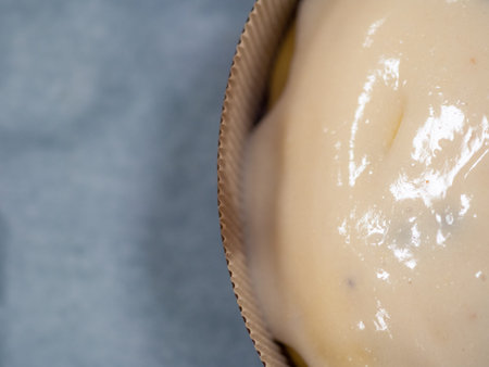 artisan chef designer finishing a bunch of panettone cake with sweet frosting