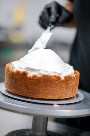 catering chef preparing key lime pie in pro kitchenの写真素材