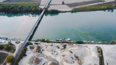 Top view of large manufacturing plant in landscape by the river Po, Piacenza Italyのeditorial素材