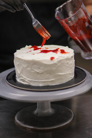 Bleeding monster cake with knife on cake stand