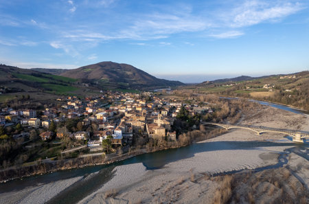 Aerial scenic view of Travo Village, Trebbia river, Valley landscape, Piacenza Italy at sunsetの写真素材