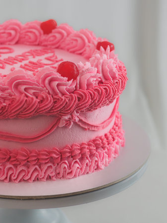 pink sweet frosted icing cup cake with italian english text sign lettering topping for bithday. Fun...