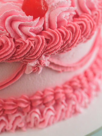 pink sweet frosted icing cup cake with italian english text sign lettering topping for bithday. Fun aging. Humorous food concept.の写真素材