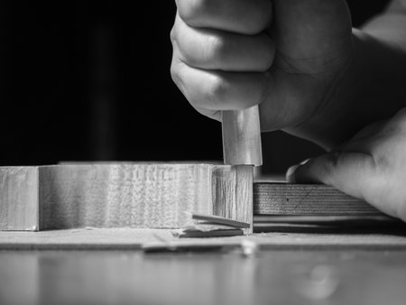 luthier violin maker luthier working with violin mold on center bot, corner blocks , bend ribs for a new classic handmade violin using moldの写真素材