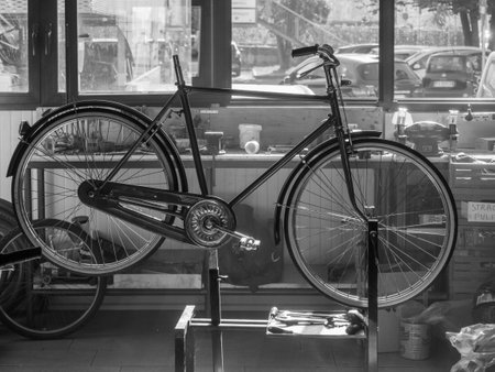 at the bike shop store and repair, artisan expert mechanic expert repairs restore bicycleの写真素材