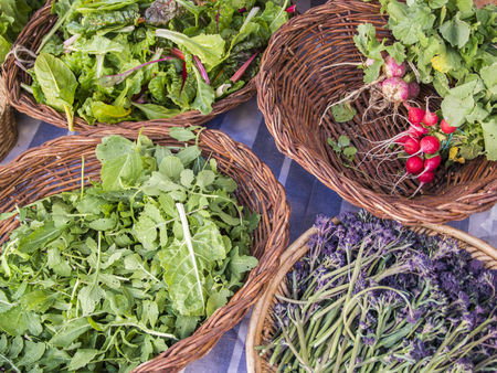 Vegetables and spices in wicker basketsの写真素材