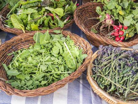 Vegetables and spices in wicker basketsの写真素材