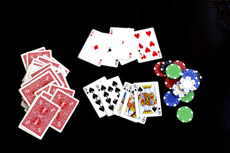poker combinations, chips and playing cards on a table