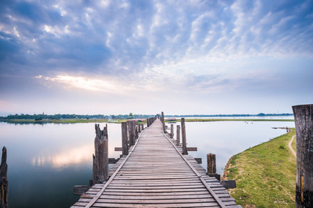 Cloudy and beautiful day on the top of the U-Bein Bridge in Amarapura Mandalayの写真素材