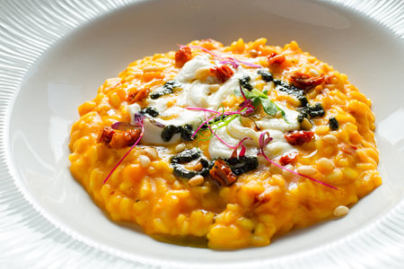 Pumpkin risotto with sun-dried tomatoes and mozzarellaの写真素材