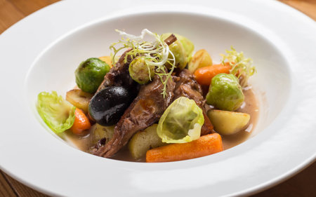 meat and vegetables on white plateの写真素材