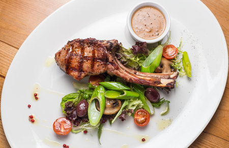 Entrecote steak meat with grilled vegetables on white plateの写真素材