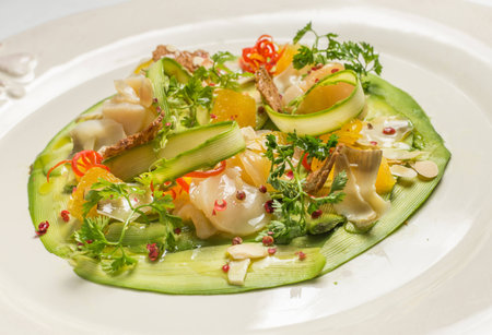 Carpaccio of prawns with citrus sauce on a white background. Gourmet cuisine. Dish of shrimpの写真素材