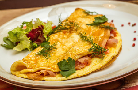 Omelet with herbs and vegetables on the plate