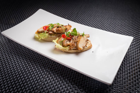 bruschetta with cheeken on white palat, restaurantの写真素材