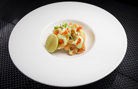 shrimp tempura with roe on white plate, restaurantの写真素材