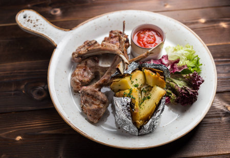 pork ribs and baked potato, restaurantの写真素材