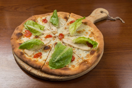 Caesar pizza on the board, restaurantの写真素材