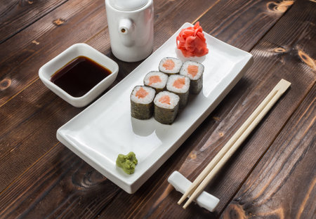 Maki rolls with smoked salmon with wasabi on back frontの写真素材
