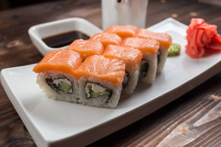 Philadelphia classic. Salmon, Philadelphia cheese, cucumber, avocado, tobiko. Japanese sushiの写真素材