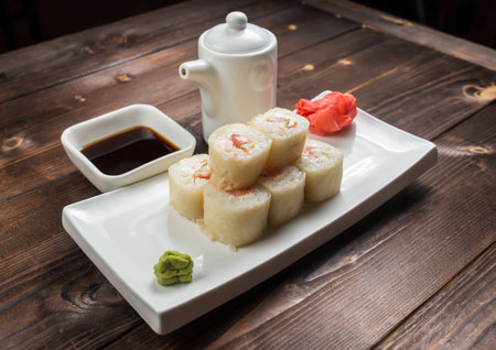 Maki rolls with smoked salmon with wasabi on back frontの写真素材