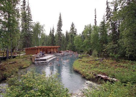 Liard River Hot Springs, BC, Canada - August 13, 2017: This is the second largest hot spring in Canada and is located in lush boreal spruce forest. Tourists can be seen bathing in the Alpha pool.のeditorial素材