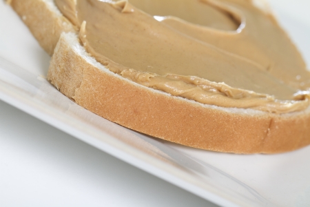 A Half of a Peanut Butter Sandwich on a Square Plate  Macro Shot on an angleの写真素材
