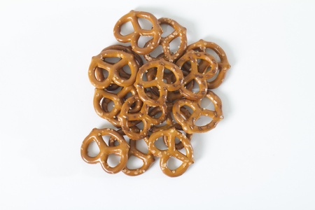 pile of pretzels shot from above on white background の写真素材