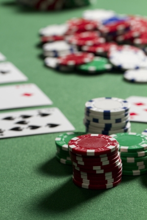 a vertical shot of poker chips from a players point of view  chips are out of focus in middle pot の写真素材