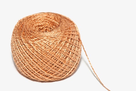 brown ball of thread isolated on white backgroundの写真素材