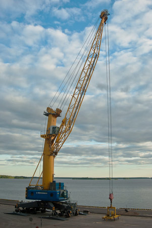 crane at the port on the Gulf coast in the background of the sky