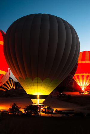 Balloon in the early morning getting ready for the start. Cappadocia.の写真素材