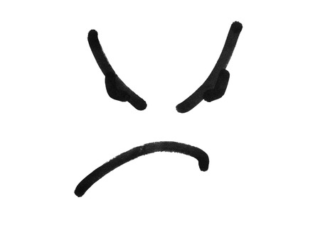 angry face smile drawing with black marker pen isolated on white backgroundの写真素材