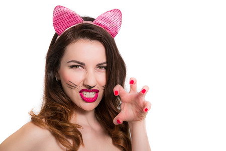 Catwoman make-up on attractive hot model. Pink lipstick, nailpolish isolatedの写真素材