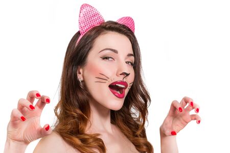 Cat-woman make-up on beautiful young girl. lipstick, nailpolish isolated on white backgroundの写真素材