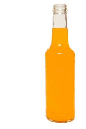 Glass bottle of orange soda isolated on whiteの写真素材