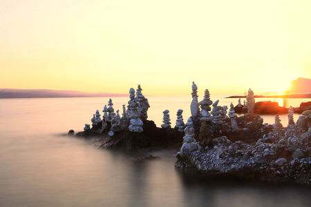 Rocks formation on the coast at sunsetの写真素材