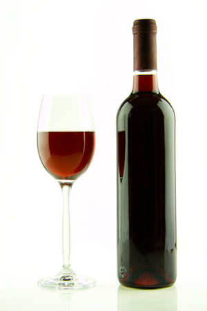 Bottle and glass of red wine isolatedの写真素材