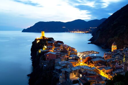 Illuminated Vernazza Village at Dusk, Cinque Terre, Italyの写真素材