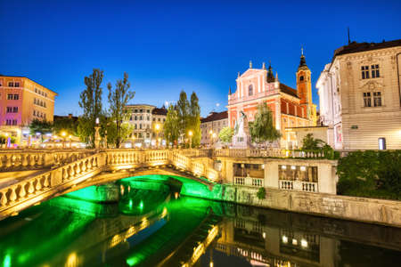 Ljubljana City Center at Dusk overlooking the Triple Bridge and Beautiful Franciscan Churchの写真素材
