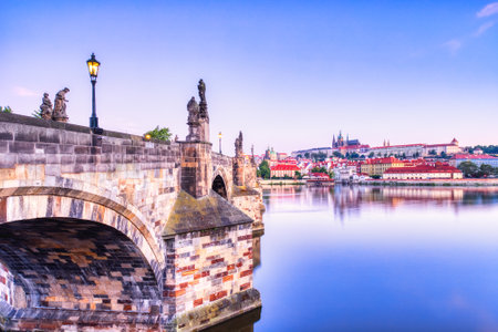 Illuminated Charles Bridge at Dusk, Prague, Czech Republicの写真素材