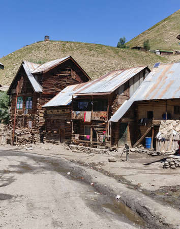 Old wooden houses in the village of Tien Shan, Kyrgyzstanの写真素材