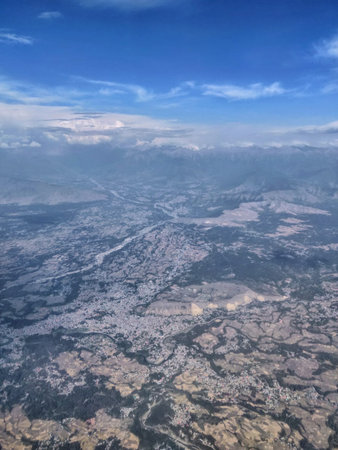 Aerial view of a city from airplane window. Travel concept.