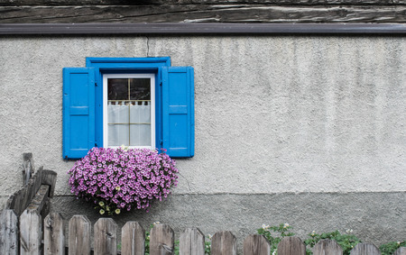 an old mountain house windowの写真素材