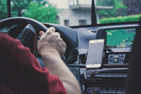 old man driving super carの写真素材